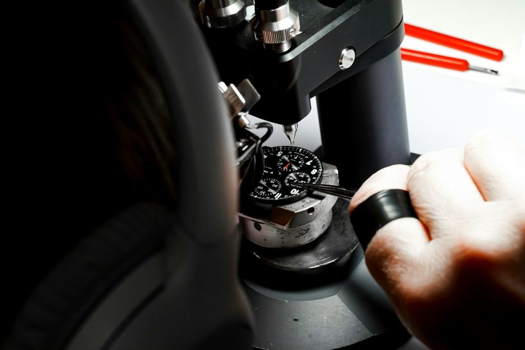 a person is looking through a microscope at something